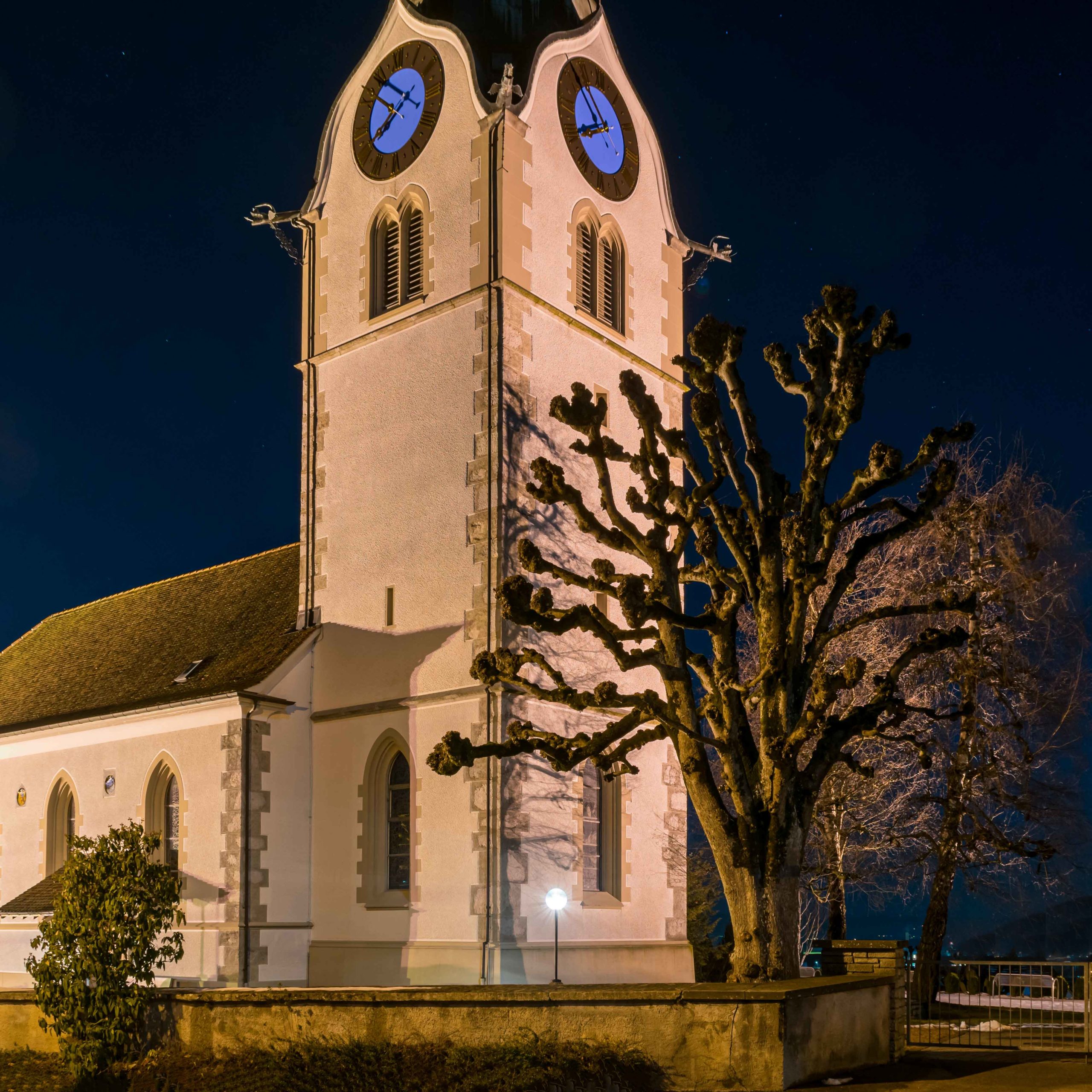 Knock Knock - Church with trees at night, in Reinach. 