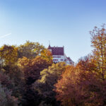 Schloss Lenzburg behind Autumn Forest